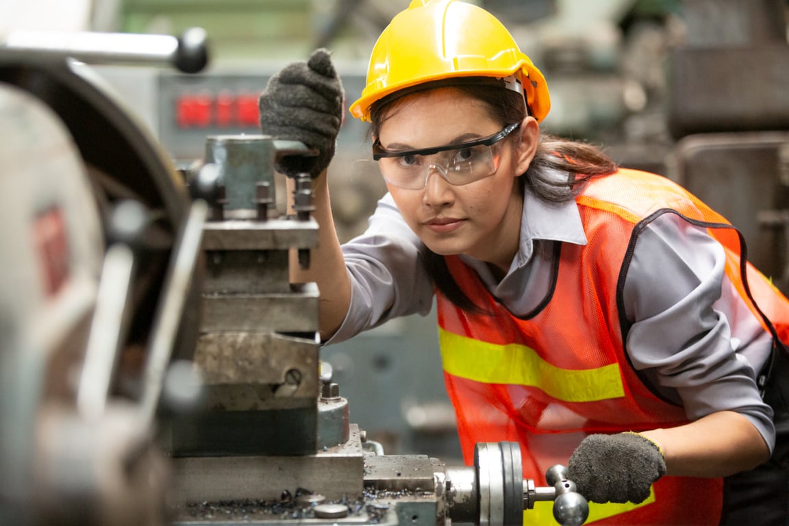 Woman Operating a Factory Machine  